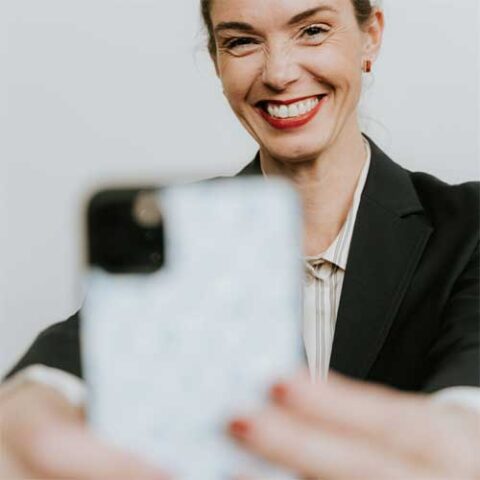 Girl with phone and a big smile